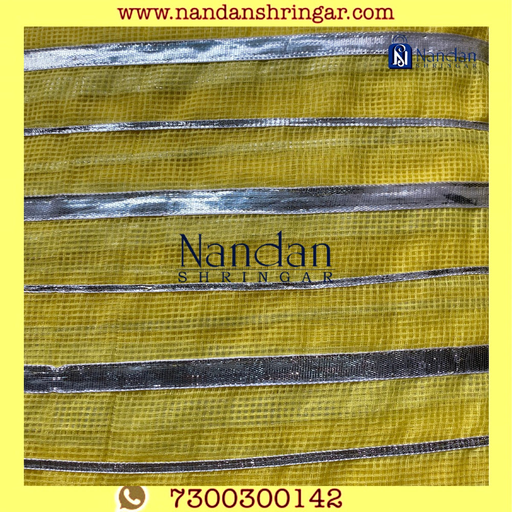 Yellow Dhora Wala Doriya Special Zari Vastra by nandanshringars, showcasing intricate zari work and vibrant color.