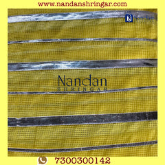 Yellow Dhora Wala Doriya Special Zari Vastra by nandanshringars, showcasing intricate zari work and vibrant color.