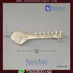 Fine silver musical set by Utsav Arts featuring intricate designs and traditional craftsmanship displayed on a neutral background.