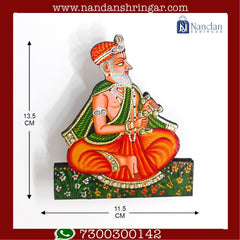 Hand-painted wooden Nand Yashoda pair from Nandanshringars, showcasing intricate details and vibrant colors.