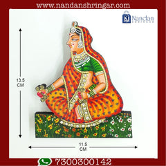 Hand-painted wooden Nand Yashoda pair from nandanshringars, showcasing intricate details and vibrant colors.