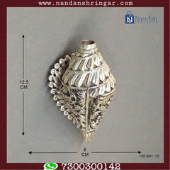 Fine silver carving shankh by Utsav Arts, featuring intricate details and a polished finish, displayed against a neutral backdrop.