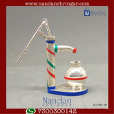 Fine silver hand pump by Utsav Arts, featuring intricate design and craftsmanship, shown against a neutral background.