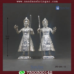 Fine silver Dwarpal from Utsav Arts, showcasing intricate design and craftsmanship in a detailed pair.