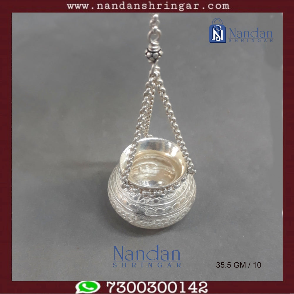 Fine silver hanging handi by Utsav Arts, featuring intricate designs and a polished finish, displayed against a neutral background.
