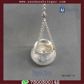 Fine silver hanging handi by Utsav Arts, featuring intricate designs and a polished finish, displayed against a neutral background.