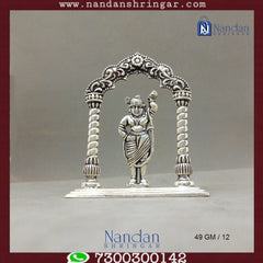 Fine silver Shreenath Ji figurine from Utsav Arts, showcasing intricate details and vibrant colors in a traditional design.
