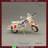Fine silver motorcycle sculpture by Utsav Arts, showcasing intricate detailing and craftsmanship.