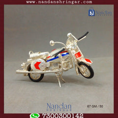 Fine silver motorcycle sculpture by Utsav Arts, showcasing intricate detailing and craftsmanship.