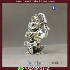 Fine silver Shree Ganesh idol by Utsav Arts, showcasing intricate details and traditional craftsmanship.