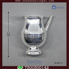Fine silver Jhari Ji piece by Utsav Arts, featuring intricate detailing and elegant design, displayed on a neutral background.