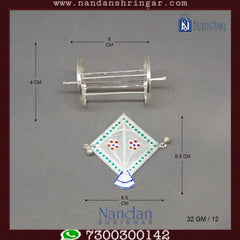 Fine silver Patang Chakri set by Utsav Arts, showcasing intricate designs and craftsmanship in a decorative display.