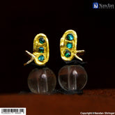 Silver Jadaau MakraKrit Kundal with Panna stones by nandanshringars, showcasing intricate design and craftsmanship.