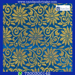 Dark blue designer Zari Vastra by nandanshringars, showcasing intricate patterns and luxurious fabric draping elegantly.