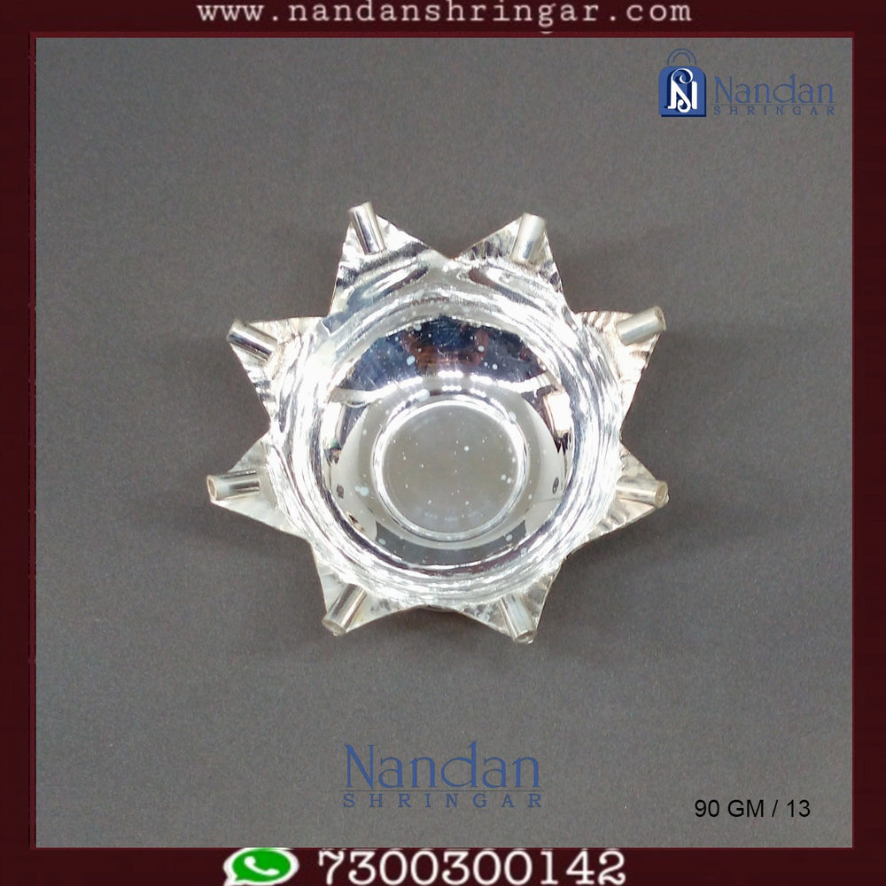 Fine silver Kamal Aarti by Utsav Arts, featuring intricate design and craftsmanship in a traditional spiritual setting.