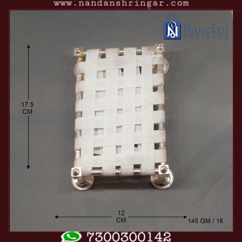 Fine silver palang from Utsav Arts, showcasing intricate craftsmanship and elegant design for decor or gifting.