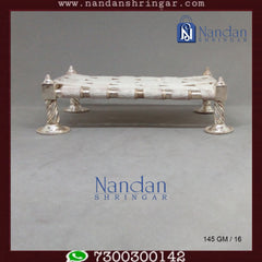 Fine silver palang from Utsav Arts, showcasing intricate design and craftsmanship in a traditional style.