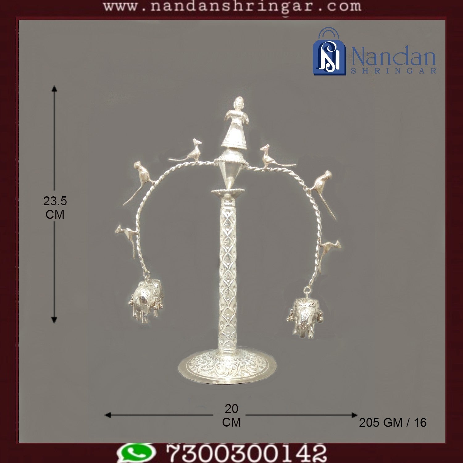 Fine silver ornament by Utsav Arts featuring intricate designs, showcasing craftsmanship and elegance in the image.
