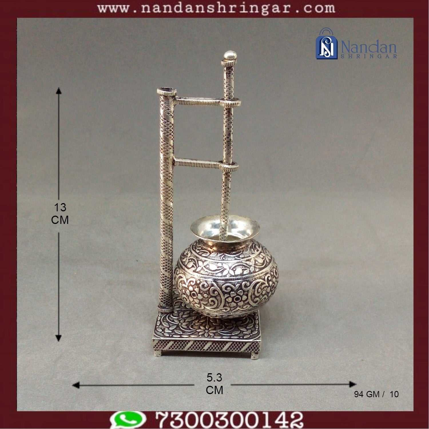Fine silver carving bilona set by Utsav Arts, showcasing intricate designs and craftsmanship in a delicate arrangement.