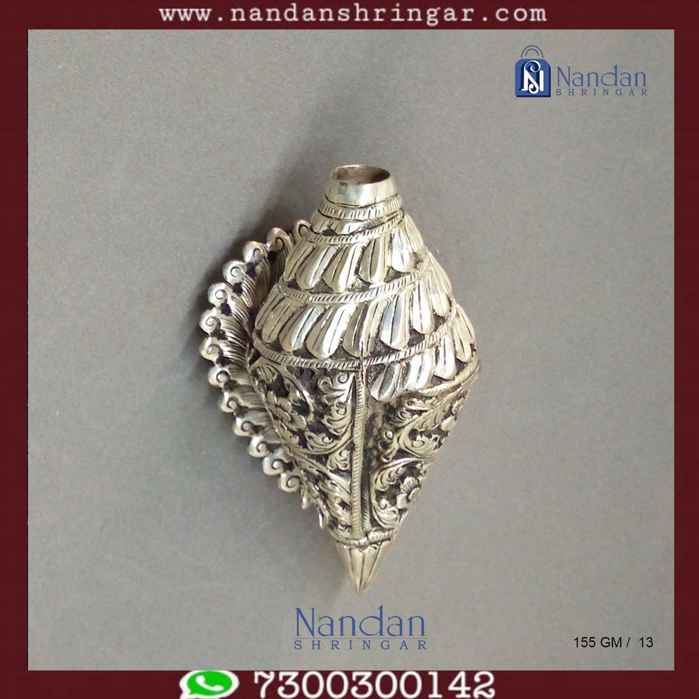 Fine silver carving shankh by Utsav Arts, showcasing intricate designs and a polished finish.