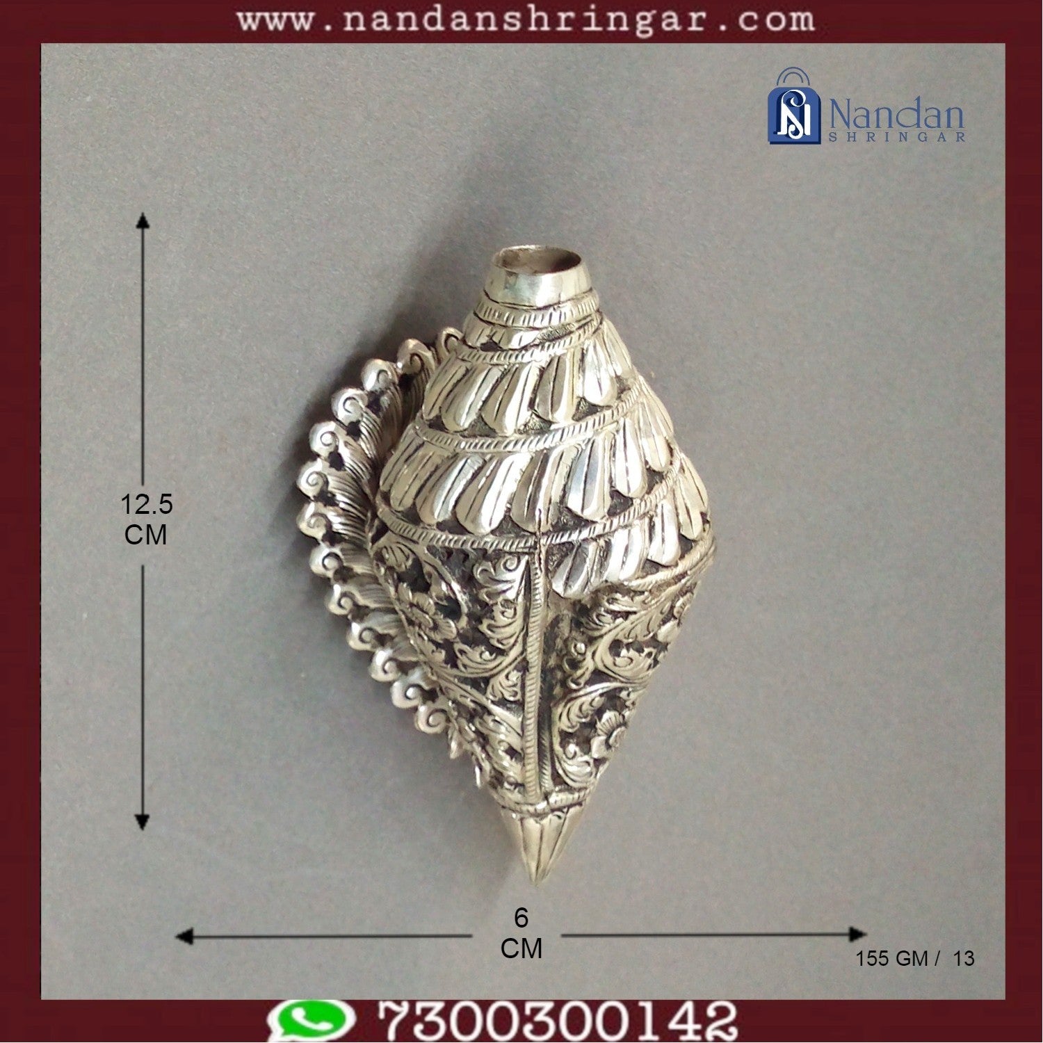 Fine silver carving shankh by Utsav Arts, featuring intricate details and a polished finish, displayed against a neutral backdrop.