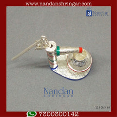 Fine silver hand pump by Utsav Arts, featuring intricate design and craftsmanship suitable for decorative use.