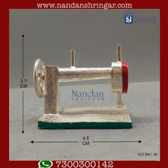 Utsav Arts fine silver sewing machine with intricate details, showcasing its sleek design and functional features.