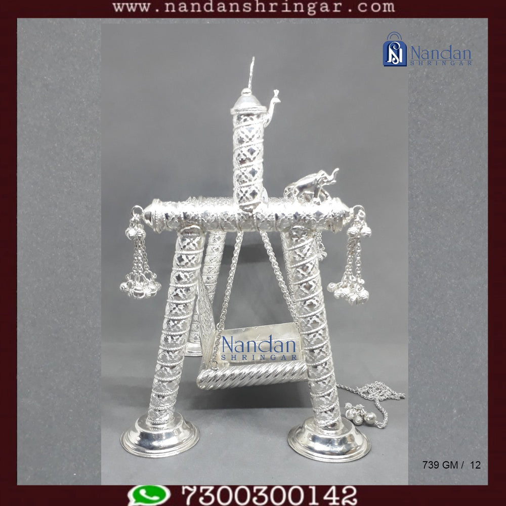 Premium fine silver carving palna by Utsav Arts, showcasing intricate designs and craftsmanship in a traditional style.