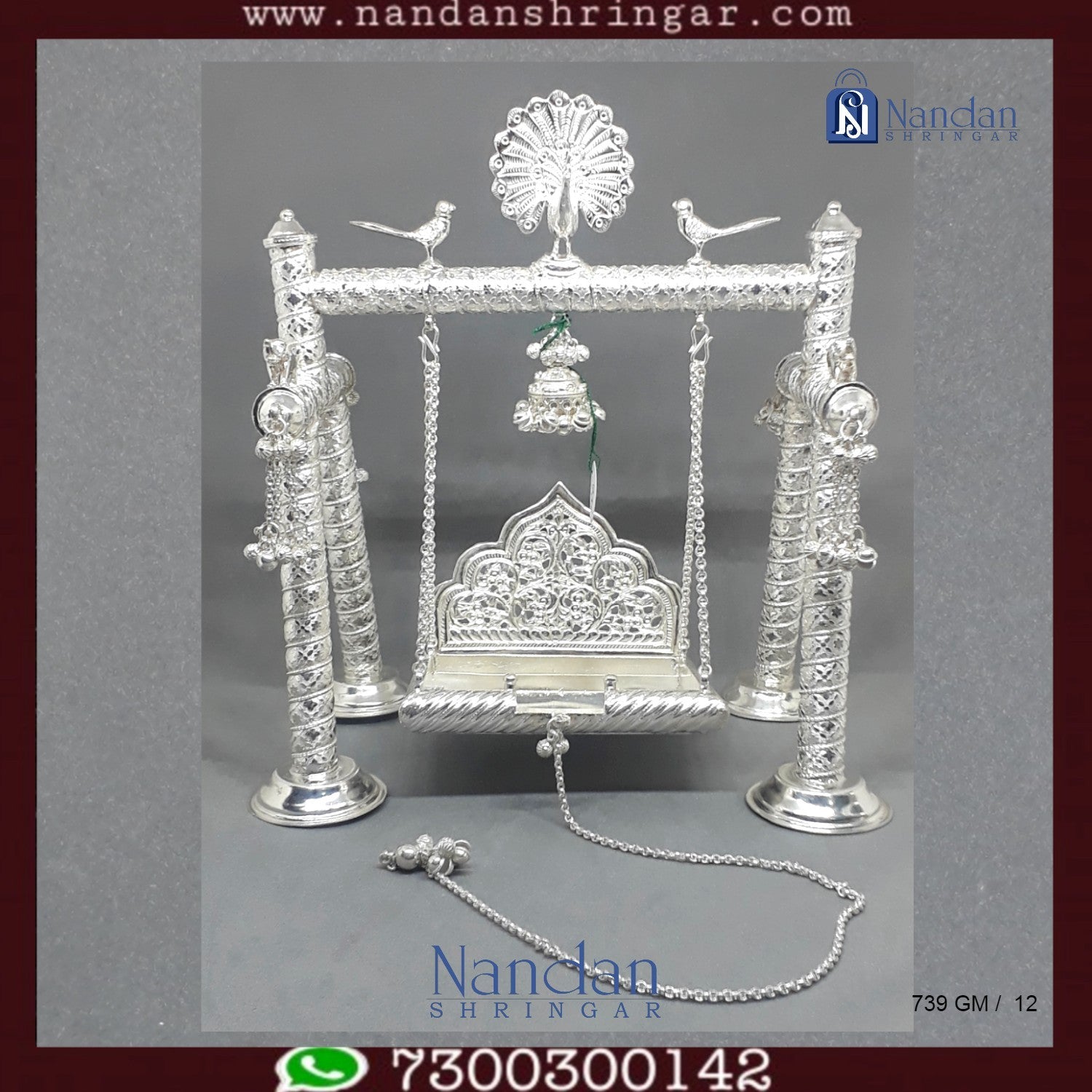 Premium fine silver carving palna by Utsav Arts, showcasing intricate designs and craftsmanship in a beautiful display.