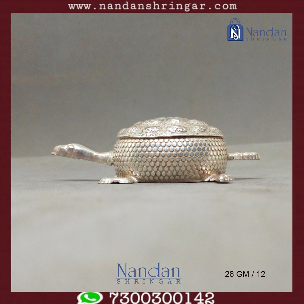 Fine silver tortoise sculpture by Utsav Arts, showcasing intricate detailing and craftsmanship in a decorative design.
