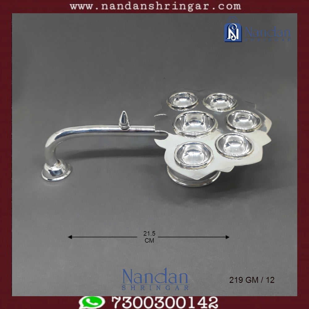 Fine silver Aarti by Utsav Arts, showcasing intricate design details and elegant craftsmanship.