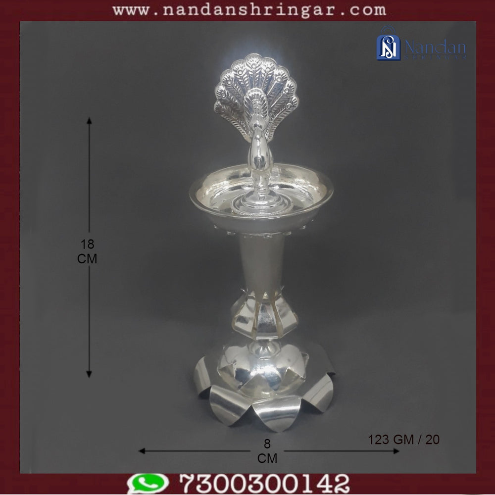 Fine silver Mayur fountain by Utsav Arts, showcasing intricate design and elegant craftsmanship in a decorative setting.