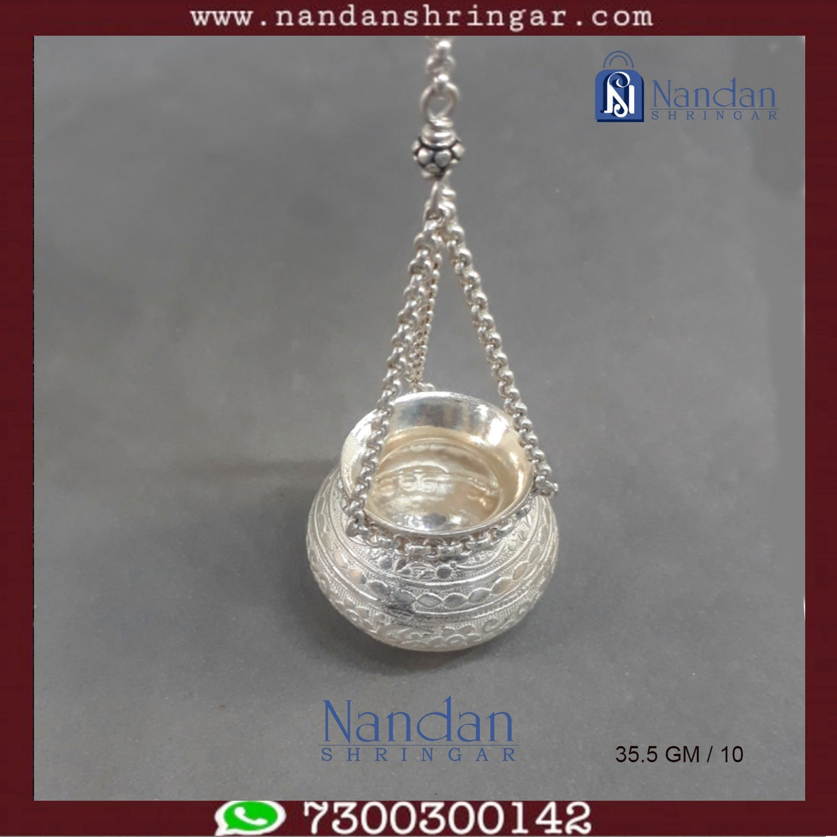 Fine silver hanging handi by Utsav Arts, featuring intricate designs and a polished finish, displayed against a neutral background.