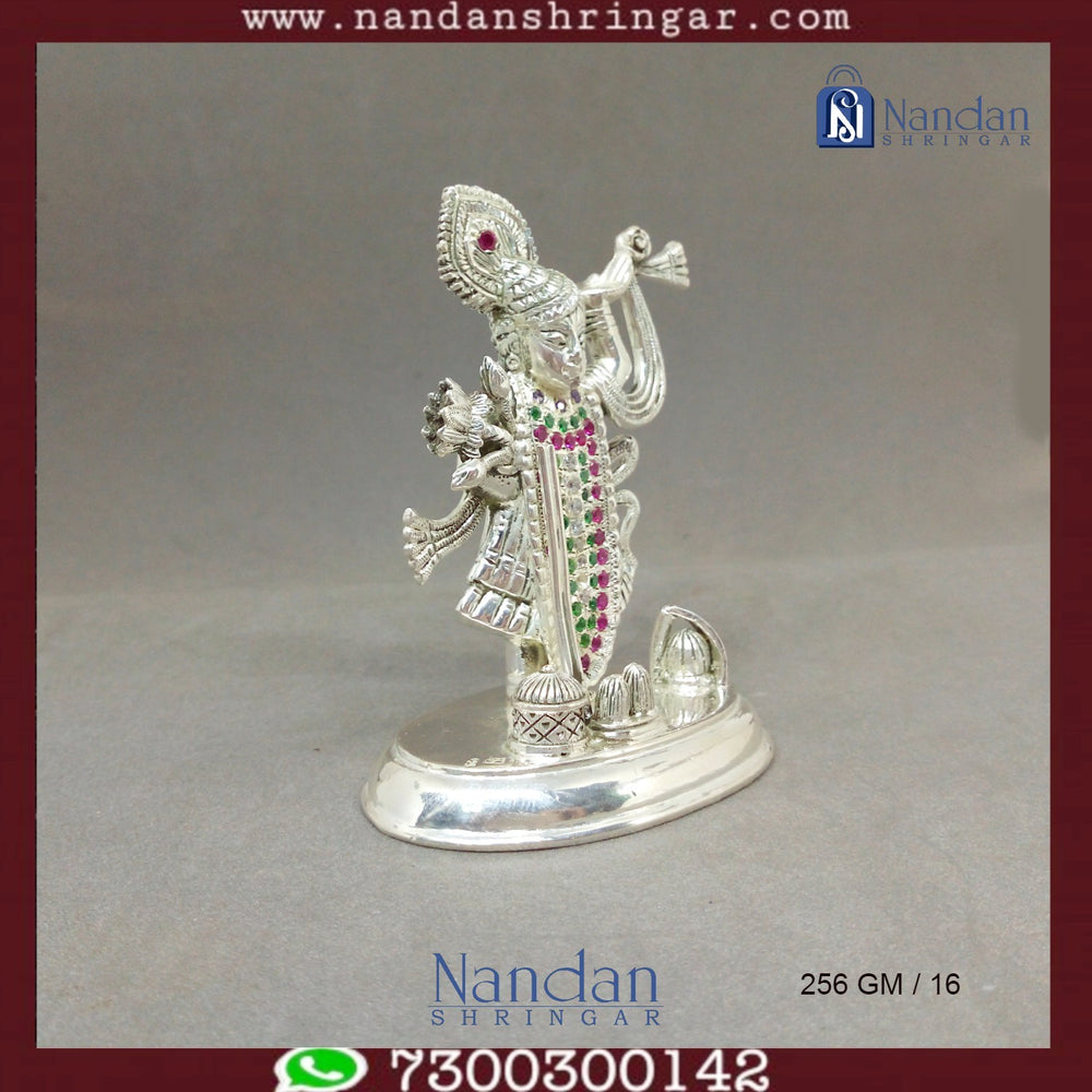 Fine silver Shreenath Ji idol from Utsav Arts, showcasing intricate details and craftsmanship in a traditional design.