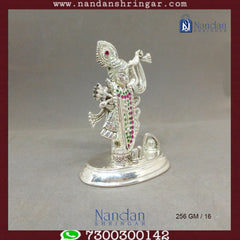 Fine silver Shreenath Ji idol from Utsav Arts, showcasing intricate details and craftsmanship in a traditional design.