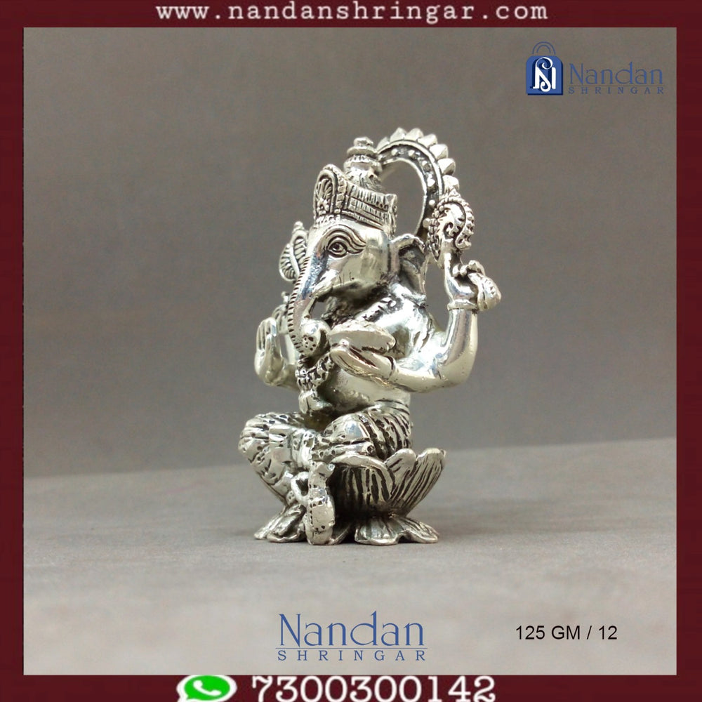 Fine silver Shree Ganesh idol by Utsav Arts, showcasing intricate details and traditional craftsmanship.