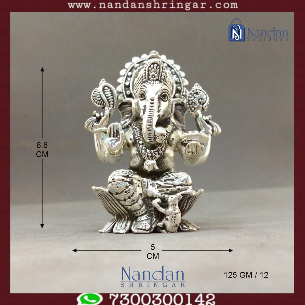 Fine silver Shree Ganesh idol by Utsav Arts, showcasing intricate details and craftsmanship in a serene pose.