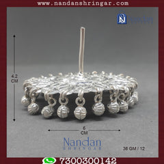 Fine silver Designer Chakri by Utsav Arts, featuring intricate detailing and a traditional design in an elegant display.