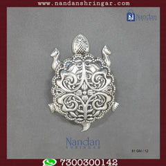 Fine silver tortoise figurine by Utsav Arts, detailed craftsmanship and smooth finish in a natural pose.
