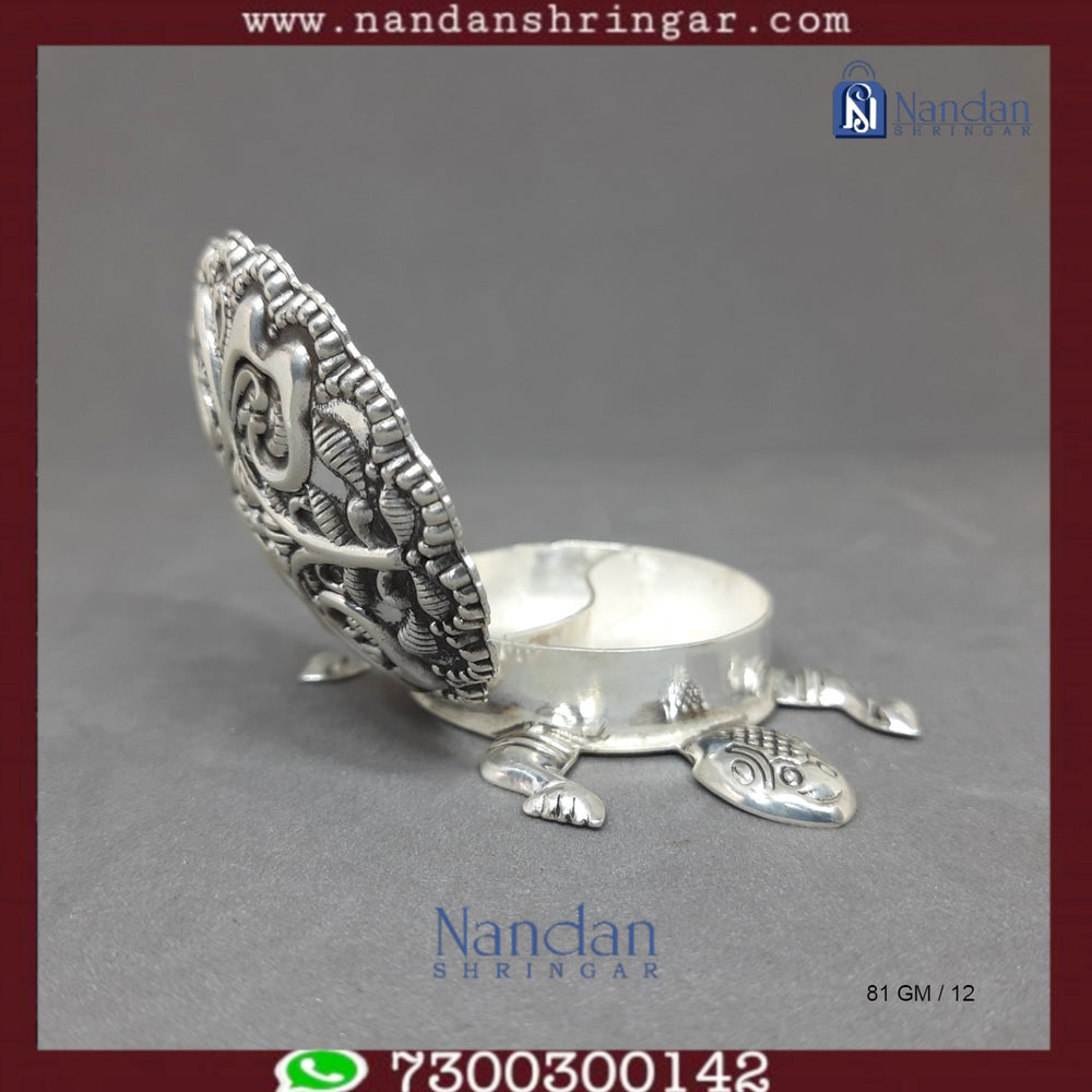 Fine silver tortoise figurine by Utsav Arts, detailed craftsmanship, showcasing a smooth silver surface and intricate design.
