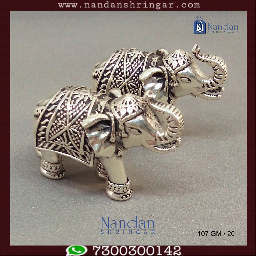 Antique fine silver elephant figurines from Utsav Arts, showcasing intricate details and craftsmanship.