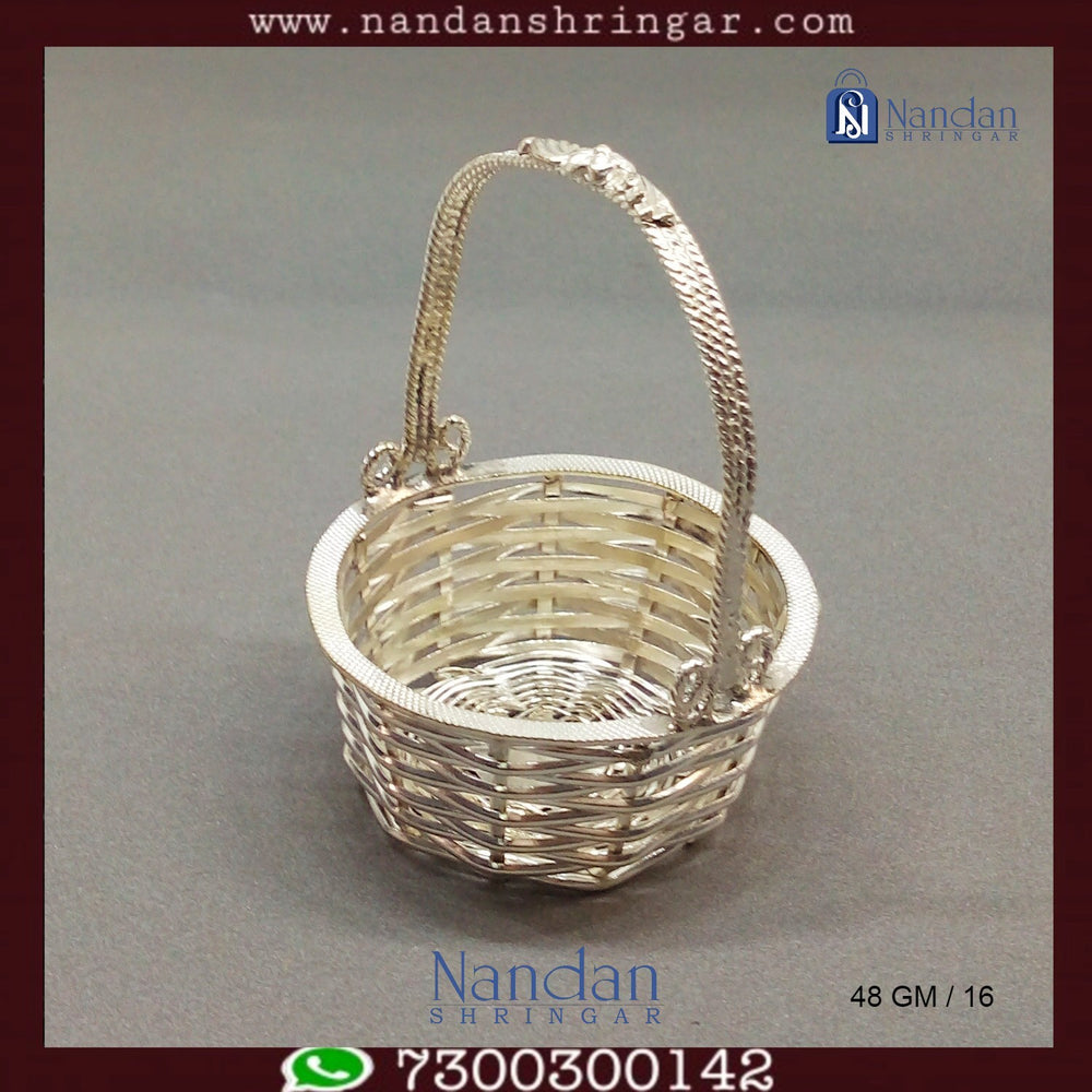 Fine silver basket by Utsav Arts, showcasing intricate design and craftsmanship, perfect for decorative use.