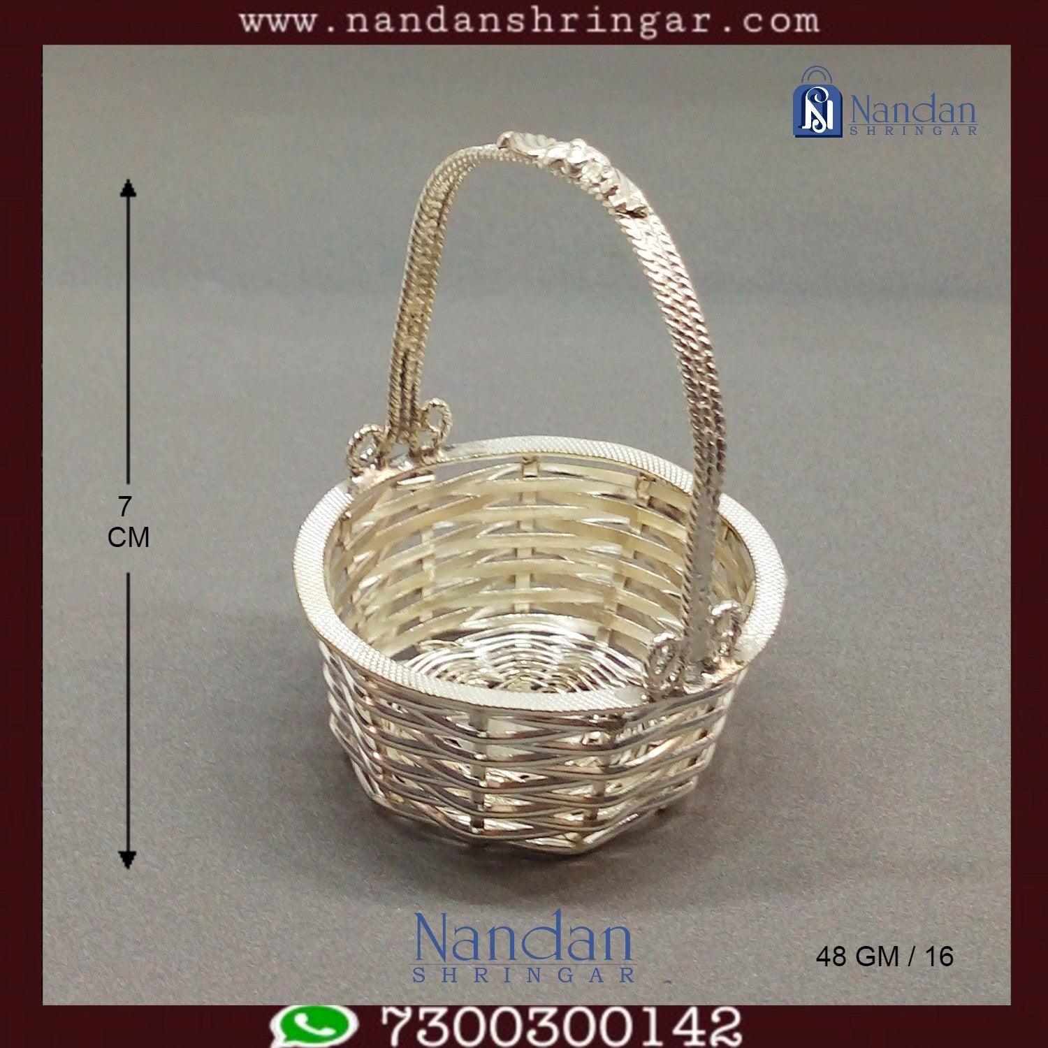 Fine silver basket by Utsav Arts featuring intricate design and craftsmanship, showcasing elegant curved handles and smooth finish.