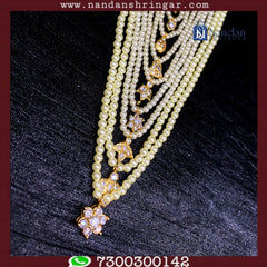 Semi Pearl Bati Mala Set by Nandanshringars featuring elegant pearls and unique design elements.