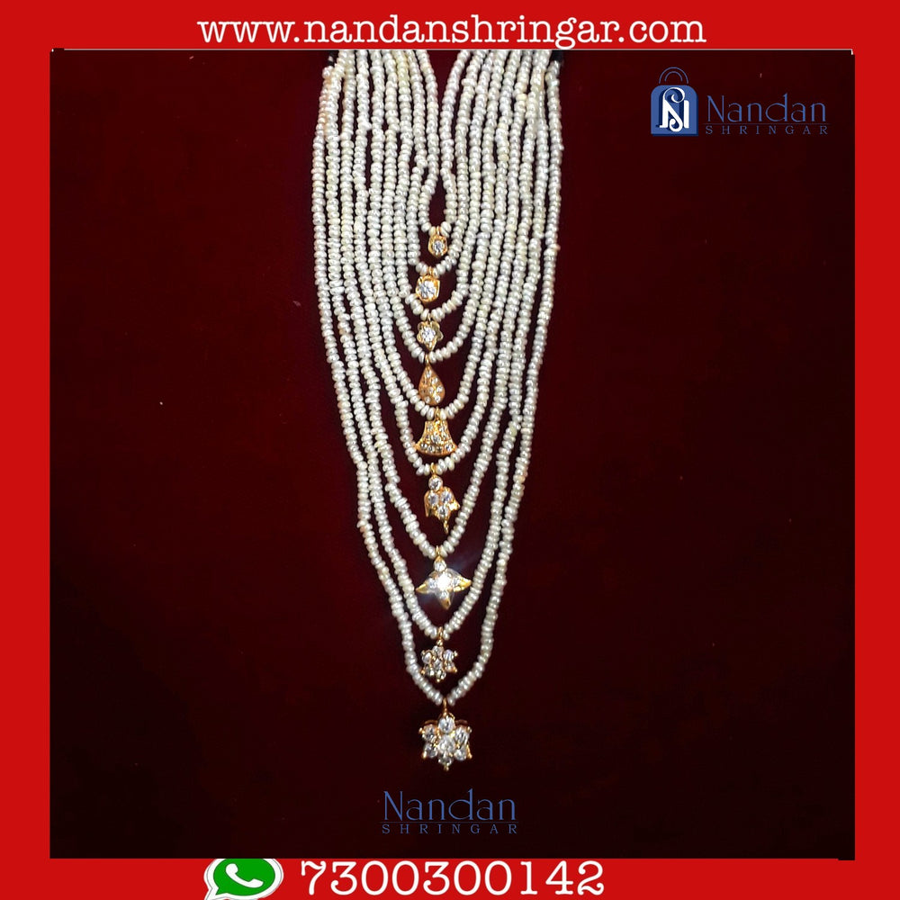 Real pearl Bati mala set by Nandanshringars, featuring elegant pearls and intricate design in a close-up view.